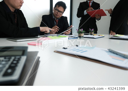 business adviser analyzing company financial report. professional investor discussing idea. businessman working on startup project with co working team. business adviser analyzing company financial report. professional investor discussing idea. businessman working on startup project with co working team. 43241399