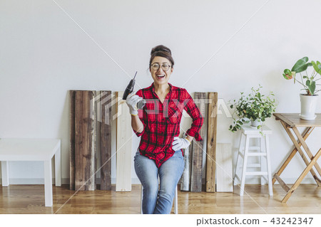 A woman enjoying DIY A woman enjoying DIY 43242347
