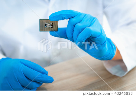 Close up portrait of engineer hand is holding CPU 43245853