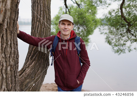 Man with backpack in a park 43246856