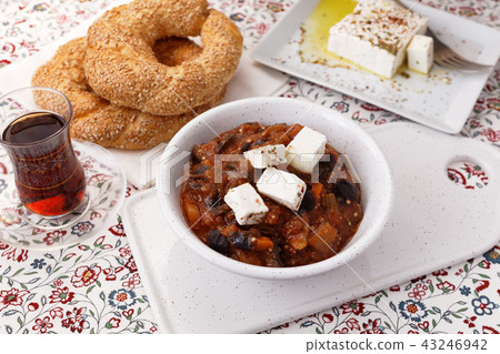 Eggplant and pepper stew with Feta, Turkish tea and simits 43246942