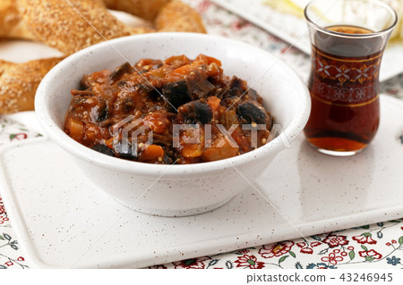 Eggplant and pepper stew with Turkish tea and simits 43246945