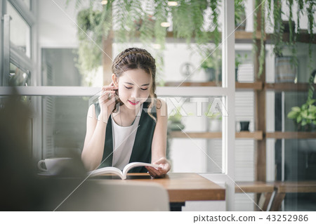 Freelancer Woman working online at her home. Freelancer Woman working online at her home. 43252986