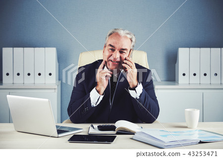 Middle-aged entrepreneur in office 43253471