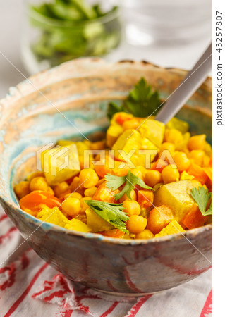 Vegan chickpea vegetables with coconut milk Vegan chickpea vegetables with coconut milk 43257807