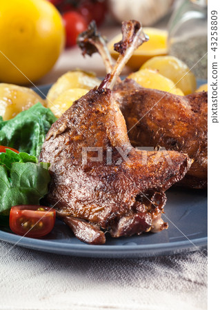 Duck legs confit with boiled potatoes Duck legs confit with boiled potatoes 43258809