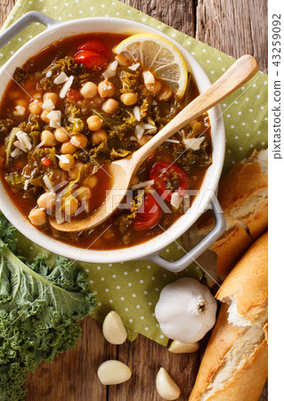 Vegetable stew of chickpeas, kale, tomato, garlic Vegetable stew of chickpeas, kale, tomato, garlic 43259092