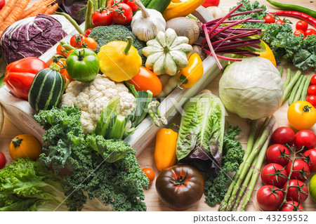 Summer vegetables on white table Summer vegetables on white table 43259552