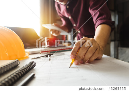 Creative architect projecting on the big drawings 43265335