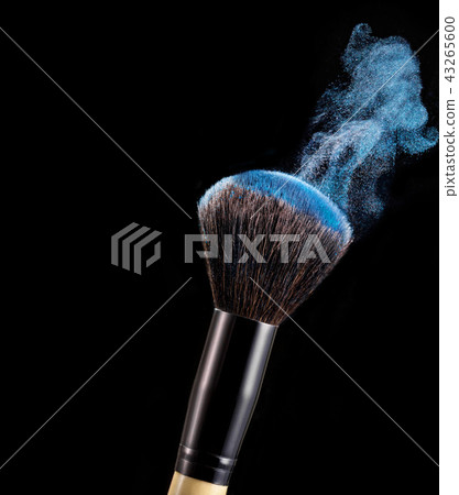 Make up brush with powder splashes on black background 43265600