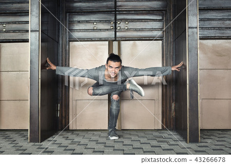 Handsome man doing yoga on urban background Handsome man doing yoga on urban background 43266678