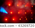 Several red stage lights in the dark 43269720