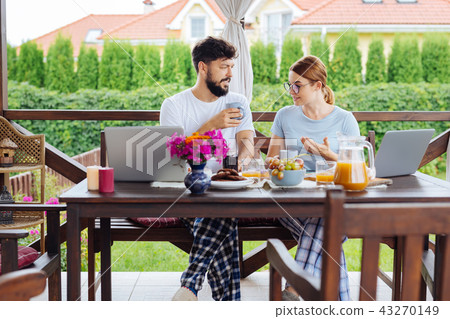 Happy couple of businessmen having delicious breakfast together 43270149