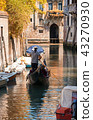 Gondola sails in a canal in autumn day in Venice 43270930