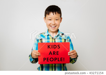 Nice boy holding a table in the hand Nice boy holding a table in the hand 43271154