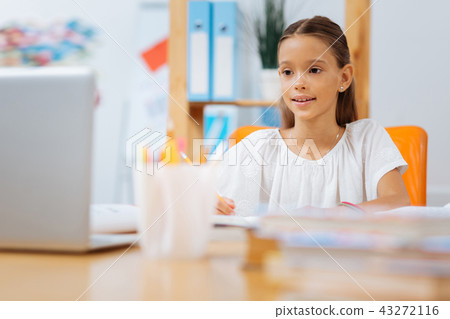 Nice cute girl sitting in a light cozy room Nice cute girl sitting in a light cozy room 43272116