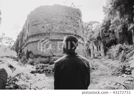 tourist man ruins fort architecture arch columns tourist man ruins fort architecture arch columns 43272731