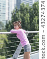Sporty woman exercising concept 43274374