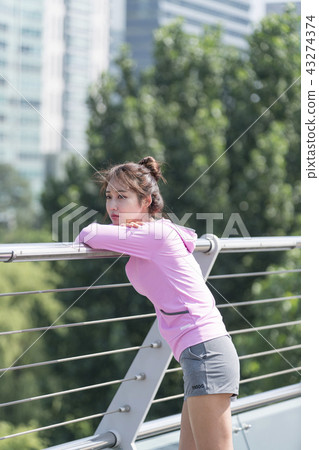 Sporty woman exercising concept 43274374
