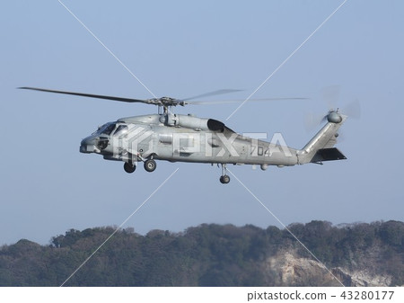 SH-60B Seahawk anti-submersible helicopter of the US Navy in Japan, who was also active in disaster dispatch of the Great East Japan Earthquake flying in the blue sky 43280177