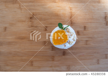 Easter, Easter cake on wooden background with a complex composition, beautiful scenery, dried fruits Easter, Easter cake on wooden background with a complex composition, beautiful scenery, dried fruits 43280338