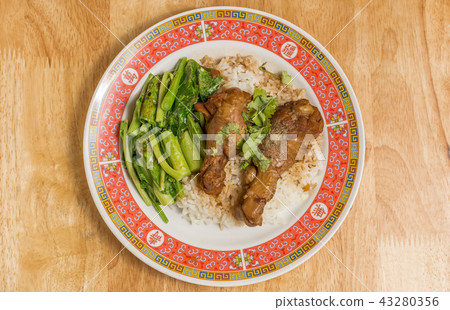 Stewed chicken with Chinese kale and rice. Stewed chicken with Chinese kale and rice. 43280356
