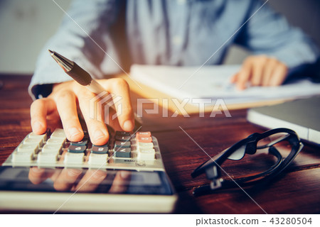 Business people are working on accounts 43280504