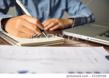 Businessman holding smart phone and working  43280506