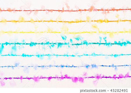 The rainbow colored lines drawn with a thin marker are wet with water. 43282491