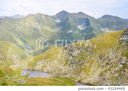 Lakes in Fagaras Mountains in a cloudy day Lakes in Fagaras Mountains in a cloudy day 43284468