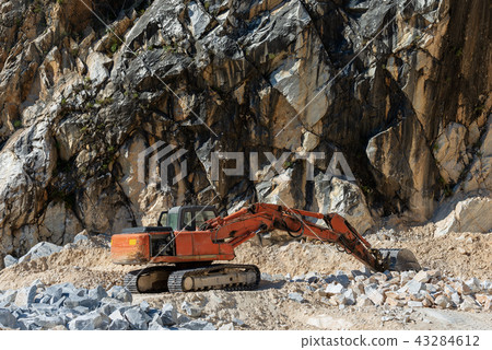 Earth Mover in a Marble Quarry - Carrara Italy 43284612