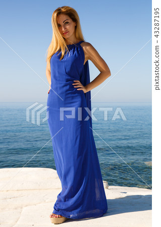 Blond woman in blue 43287195