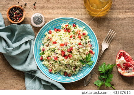 Couscous salad Tabbouleh with pomegranate seeds 43287615