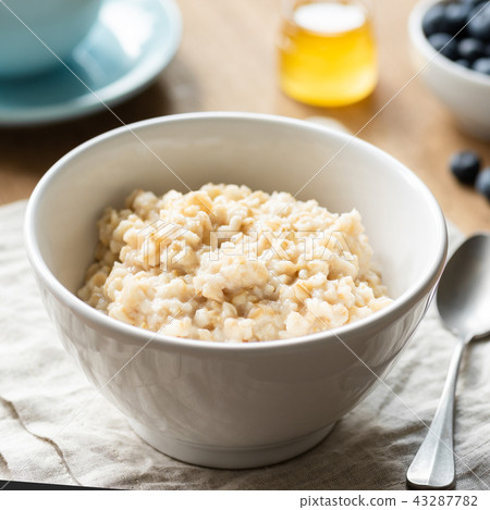 Oatmeal porridge, scottish oats in a bowl 43287782