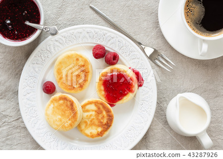 Cottage cheese pancakes with jam and coffee Cottage cheese pancakes with jam and coffee 43287926