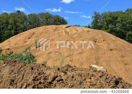 Pile of sand on a vacant lot 43288868