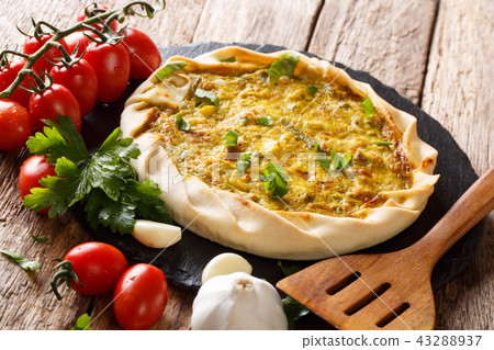 Spicy potato savory tart with vegetables and herbs 43288937