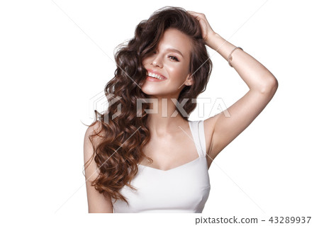 Beautiful young girl in white dress with natural make-up, hair curls and smile. Beauty face. Photo Beautiful young girl in white dress with natural make-up, hair curls and smile. Beauty face. Photo 43289937