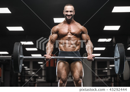 strong bodybuilder athletic men pumping up muscles strong bodybuilder athletic men pumping up muscles 43292444