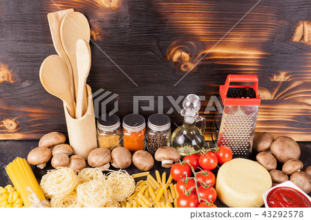 Uncooked raw macaroni, pasta and spaghetti next to fresh and healthy vegetables, Uncooked raw macaroni, pasta and spaghetti next to fresh and healthy vegetables, 43292578