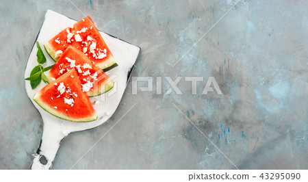 Top view of watermelon slices on white board 43295090