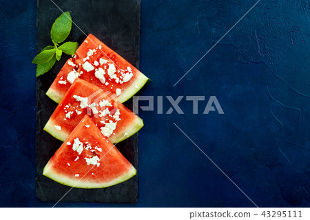 Top view of watermelon slices on blue background 43295111