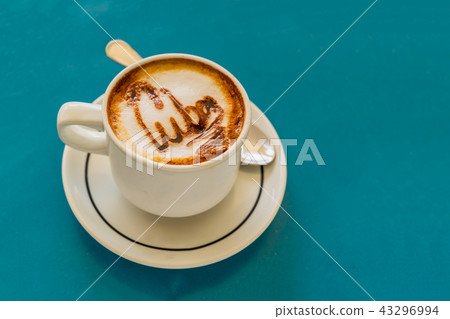 Cappuccino on a cup with foam on table Cappuccino on a cup with foam on table 43296994