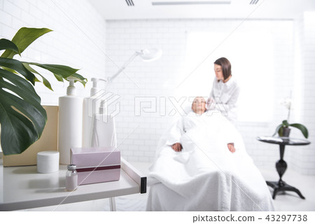 Beauty tools with beautician making injection for girl on blurred background 43297738