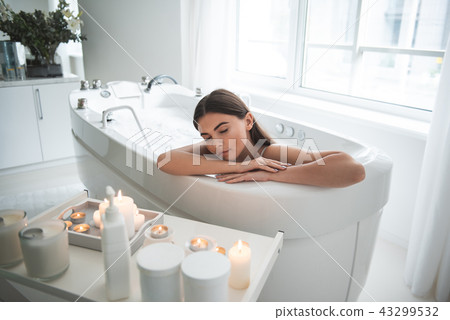Orderly woman having leisure in bath indoor Orderly woman having leisure in bath indoor 43299532
