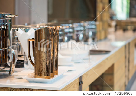 gold water jar at buffet restaurant 43299803