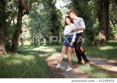 young couple walking in the forest, romantic  43299958