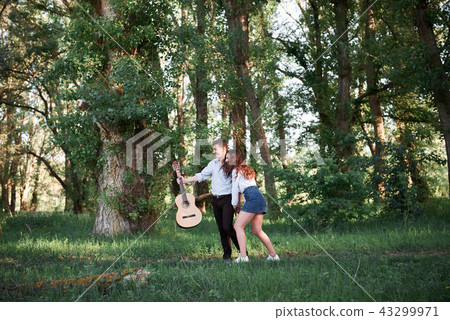 young couple walking in the forest, romantic  43299971