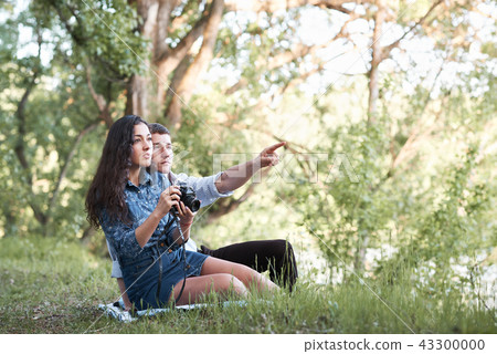 young couple walking in the forest, romantic  young couple walking in the forest, romantic  43300000