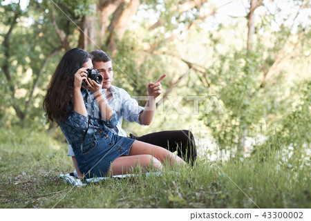 young couple walking in the forest, romantic  43300002